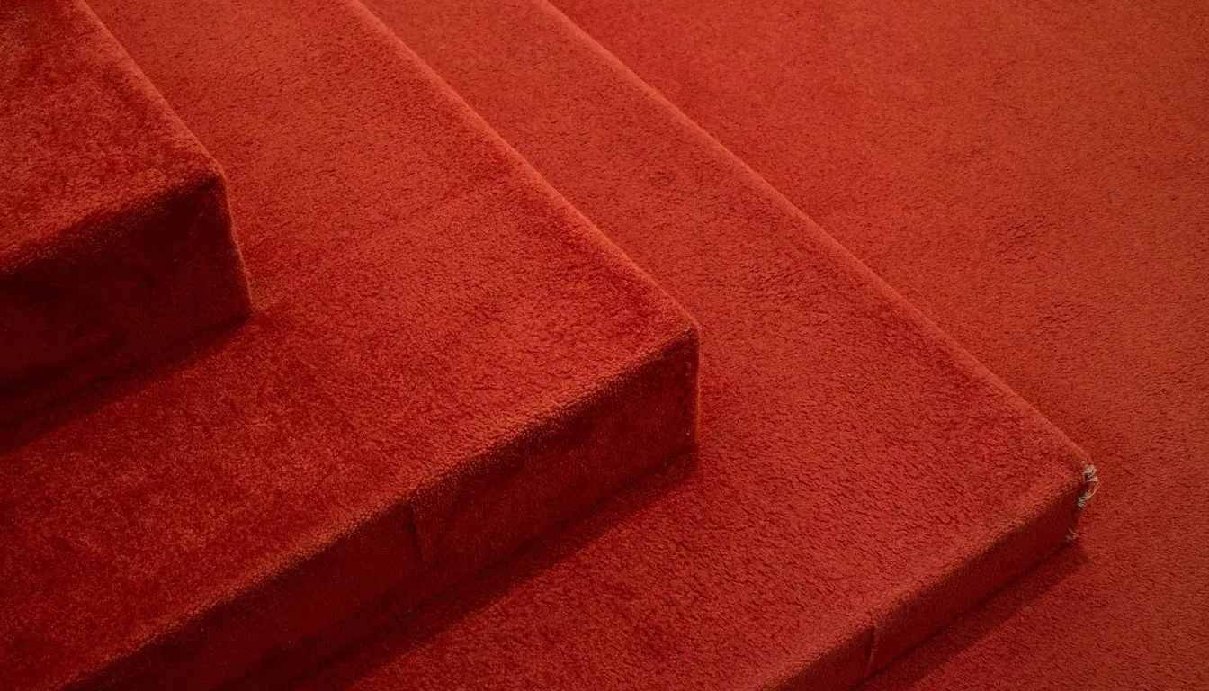 Stacked squares of deep red carpet